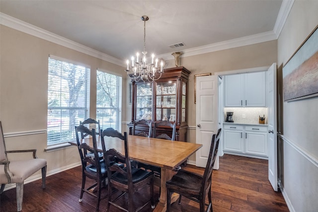 dining area with a healthy amount of sunlight, crown molding, dark hardwood / wood-style floors, and a chandelier