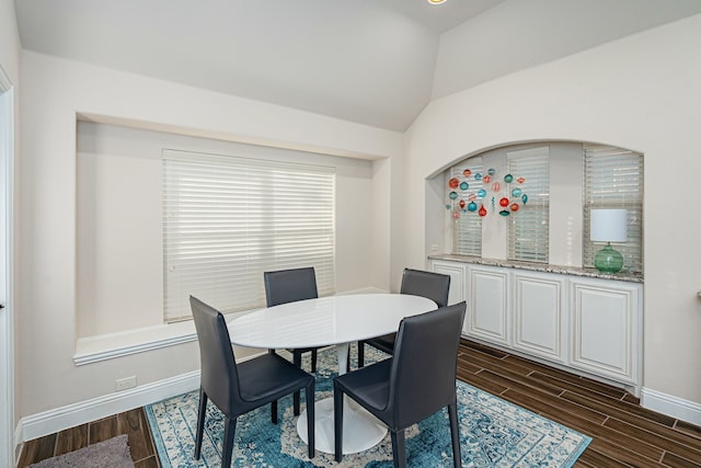 dining area with lofted ceiling