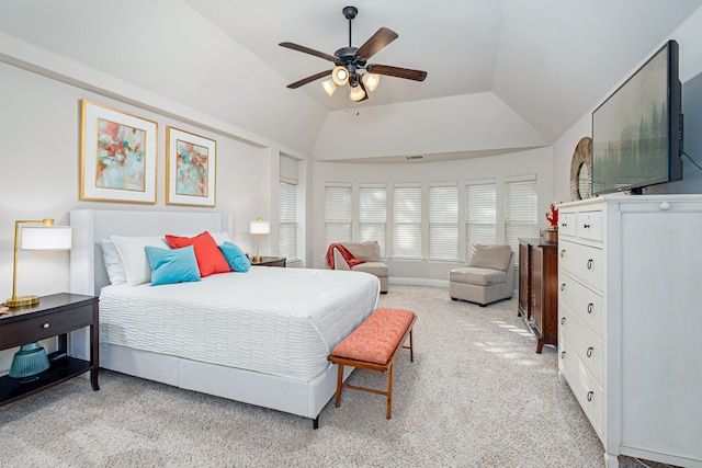 bedroom with ceiling fan, lofted ceiling, and light carpet