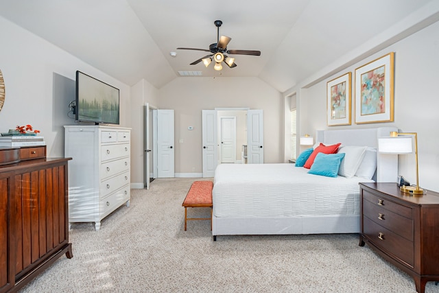 carpeted bedroom featuring vaulted ceiling and ceiling fan