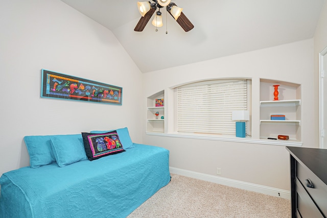 carpeted bedroom featuring ceiling fan and vaulted ceiling