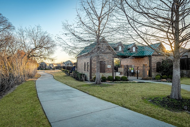 view of property's community with a lawn