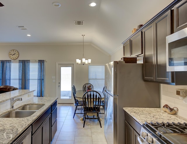 kitchen with dark brown cabinetry, sink, crown molding, and stainless steel appliances