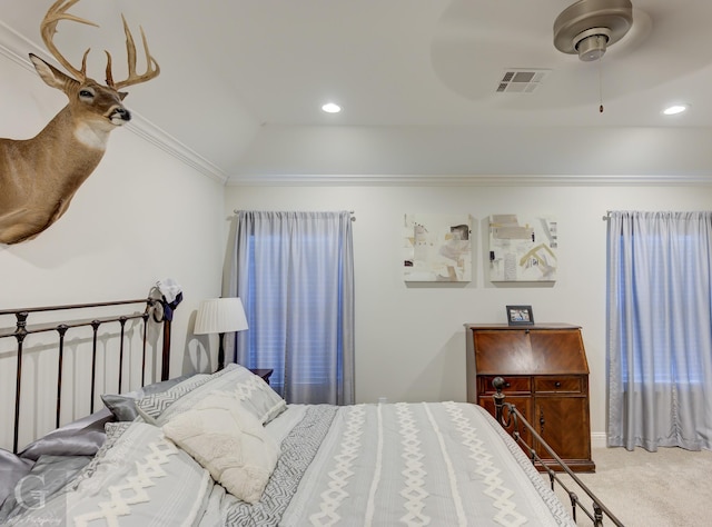 bedroom featuring vaulted ceiling, carpet floors, ceiling fan, and ornamental molding