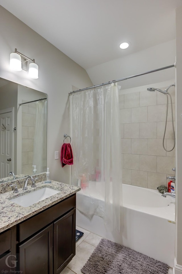 bathroom featuring tile patterned flooring, vanity, and shower / tub combo with curtain