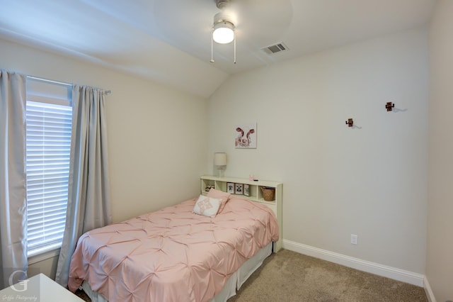 carpeted bedroom featuring vaulted ceiling and ceiling fan