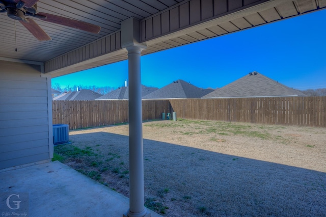 view of yard with cooling unit and ceiling fan