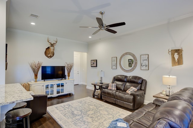 living room with dark wood-type flooring, ceiling fan, and ornamental molding