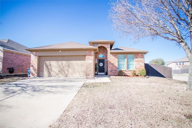 ranch-style home featuring a garage