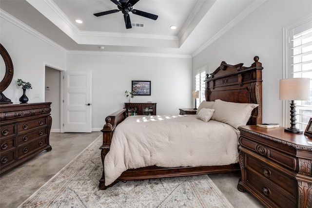 bedroom with light carpet, a tray ceiling, crown molding, and ceiling fan