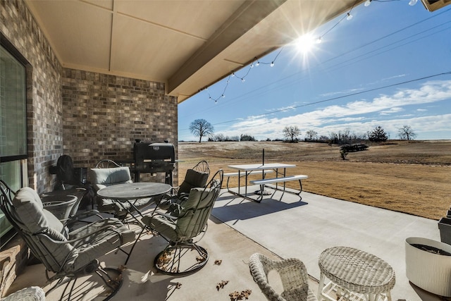 view of patio / terrace featuring a rural view