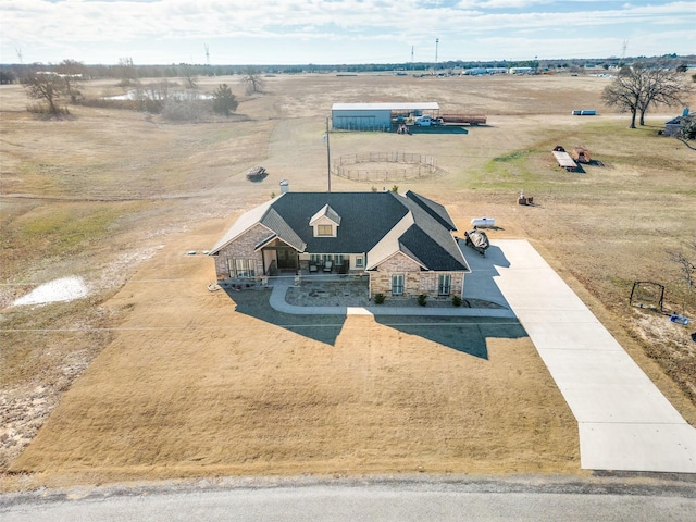 birds eye view of property with a rural view