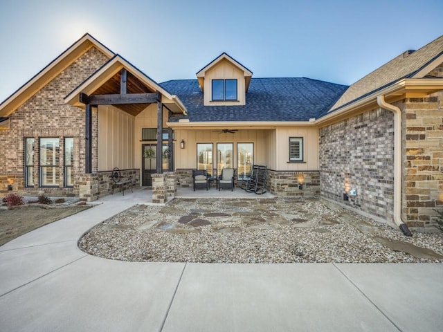 rear view of house with ceiling fan and a patio