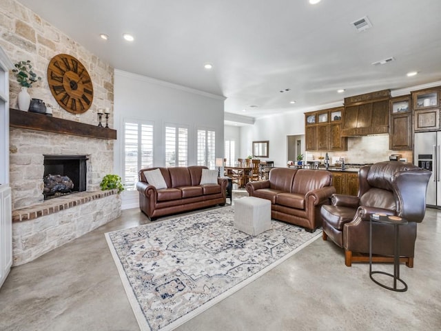 living room featuring a fireplace and ornamental molding