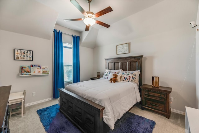 carpeted bedroom with vaulted ceiling and ceiling fan