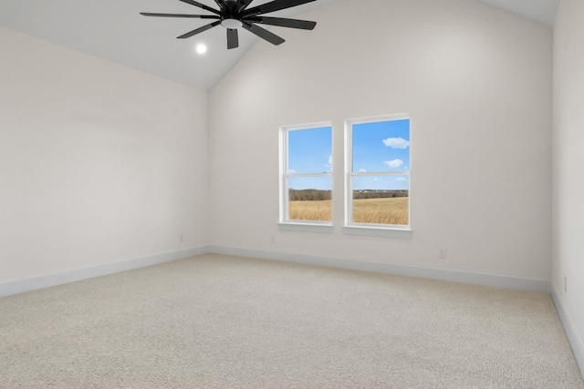 spare room with high vaulted ceiling, ceiling fan, and carpet