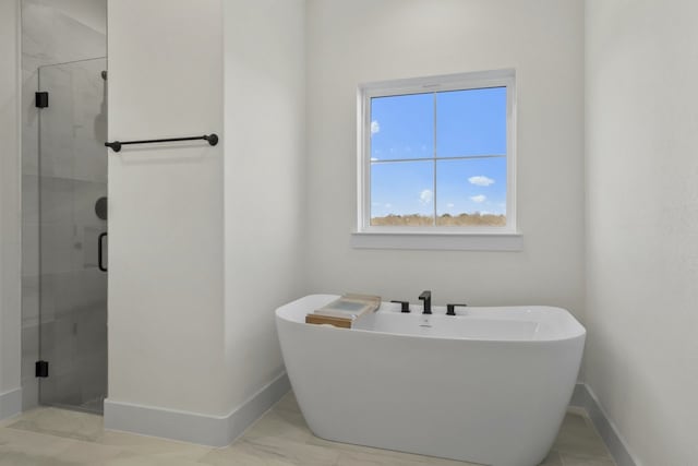 bathroom with separate shower and tub