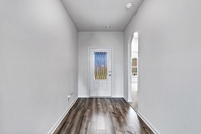 doorway featuring dark hardwood / wood-style floors