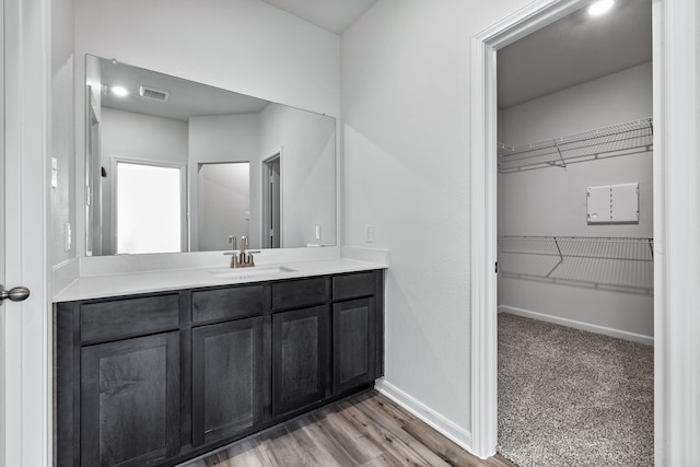 bathroom with vanity and hardwood / wood-style floors