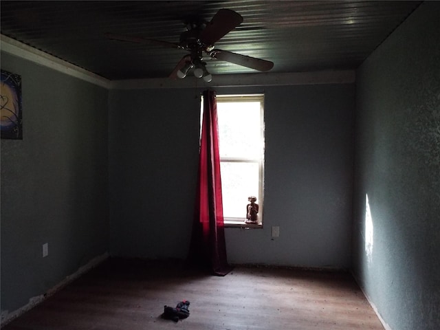 unfurnished room featuring ceiling fan and hardwood / wood-style floors