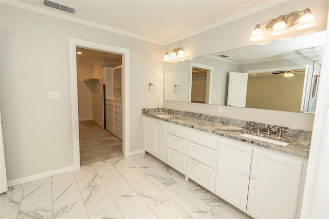 bathroom featuring vanity, ornamental molding, and ceiling fan