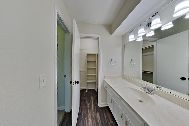 bathroom featuring vanity and wood-type flooring