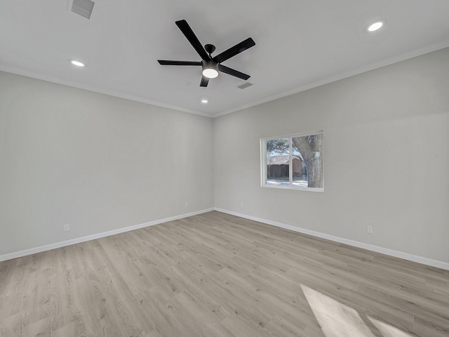 spare room featuring crown molding, ceiling fan, and light hardwood / wood-style flooring