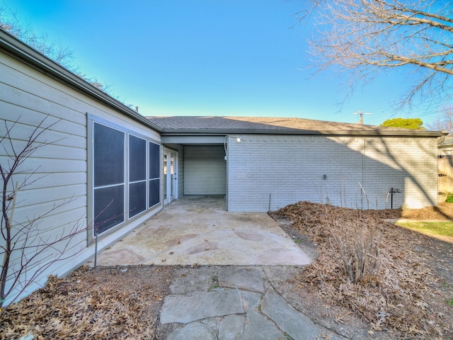 view of home's exterior with a patio