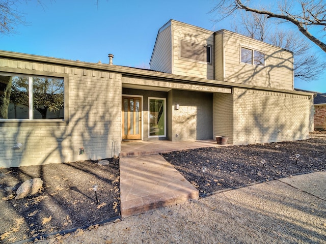 rear view of house with a patio