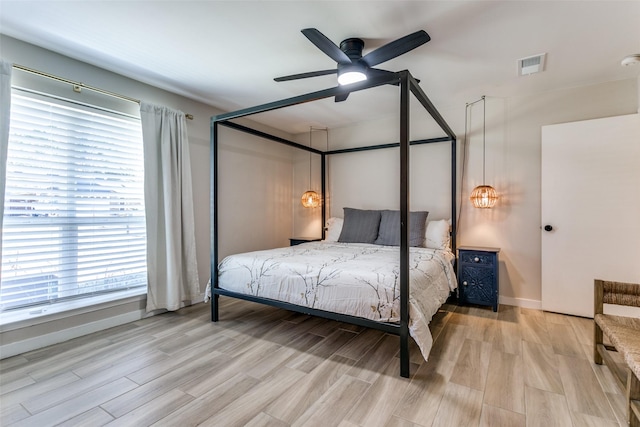 bedroom featuring light hardwood / wood-style flooring and ceiling fan