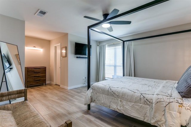 bedroom featuring light wood-type flooring and ceiling fan