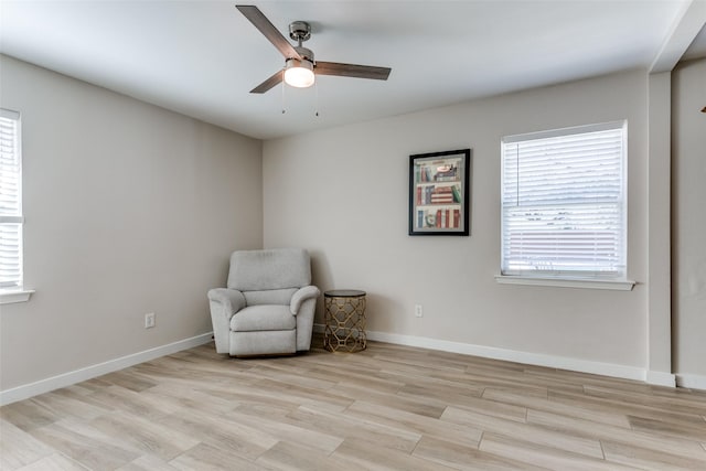 unfurnished room with plenty of natural light, ceiling fan, and light wood-type flooring