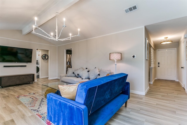 living room with an inviting chandelier, vaulted ceiling with beams, stacked washer and dryer, and light wood-type flooring