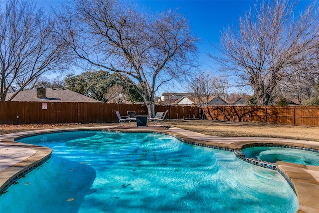 view of pool with an in ground hot tub and a patio