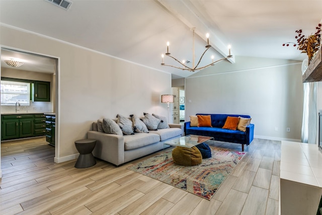 living room with an inviting chandelier, sink, and lofted ceiling with beams