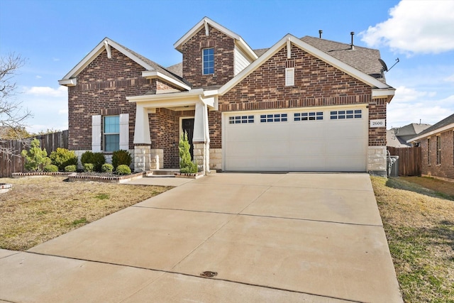 view of front of property with a garage and a front lawn