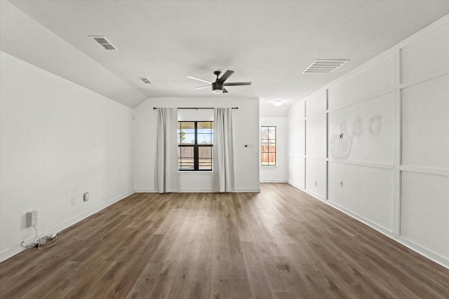 spare room with dark wood-type flooring, ceiling fan, and lofted ceiling