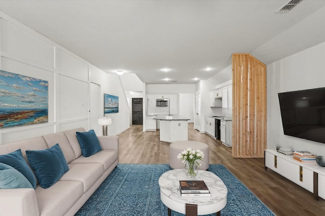 living room featuring dark wood-type flooring