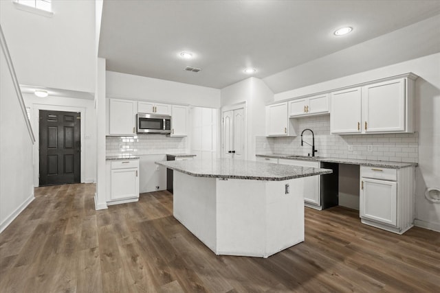 kitchen with white cabinetry and sink