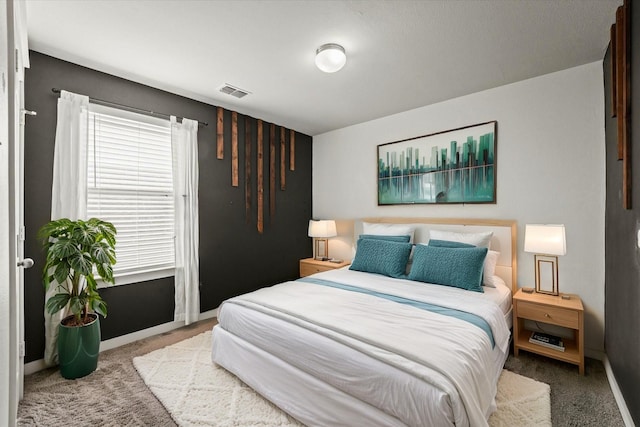 bedroom featuring light colored carpet