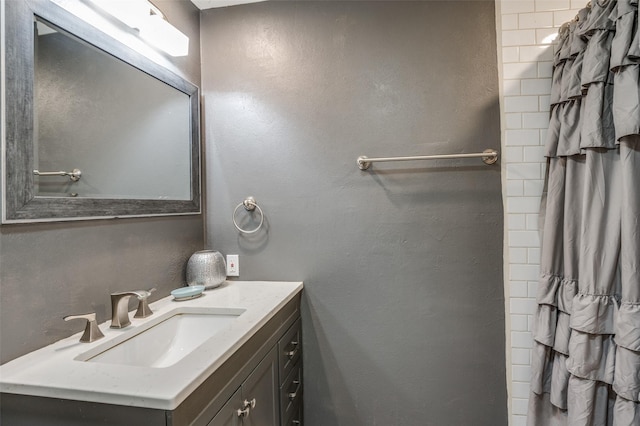 bathroom with vanity and a shower with shower curtain