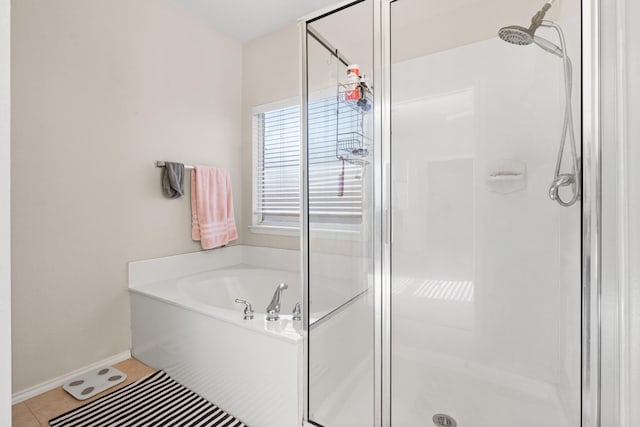 bathroom featuring separate shower and tub and tile patterned flooring