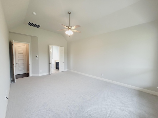 interior space with light carpet, vaulted ceiling, and ceiling fan