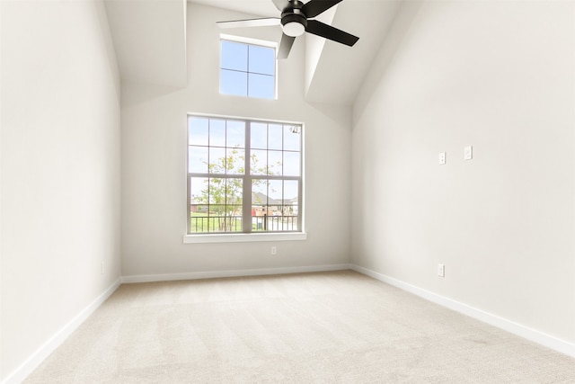 604 Tall Grass Trl, Wylie, TX 75098 - empty room with ceiling fan, healthy amount of natural light, carpet, baseboards, and a high ceiling