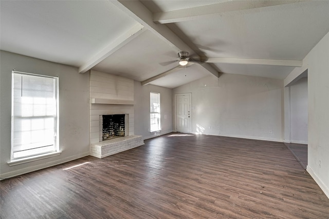 unfurnished living room with dark hardwood / wood-style flooring, a brick fireplace, lofted ceiling with beams, and ceiling fan