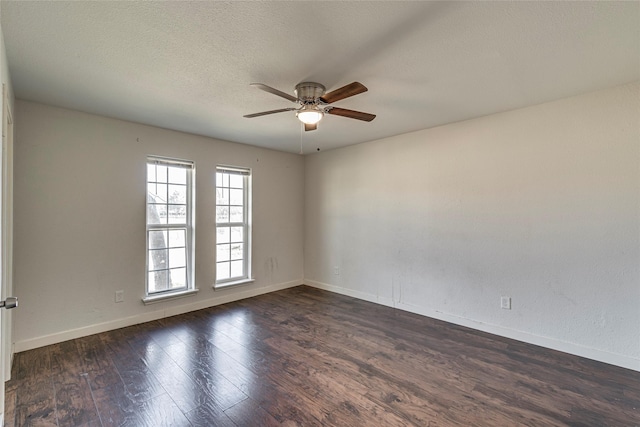 unfurnished room with dark wood-type flooring, ceiling fan, and a textured ceiling