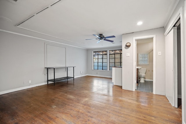 interior space featuring hardwood / wood-style flooring and ceiling fan