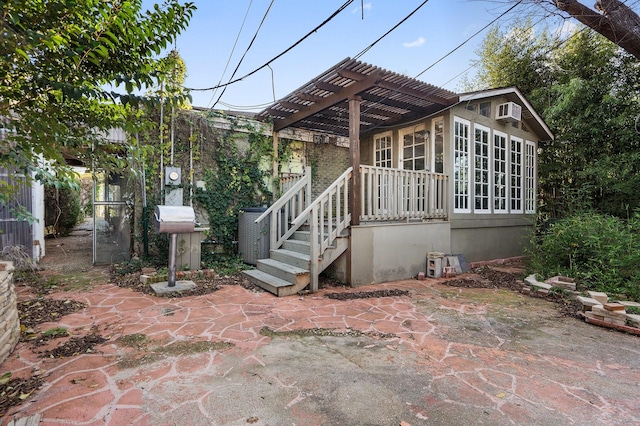 exterior space with a patio and a pergola