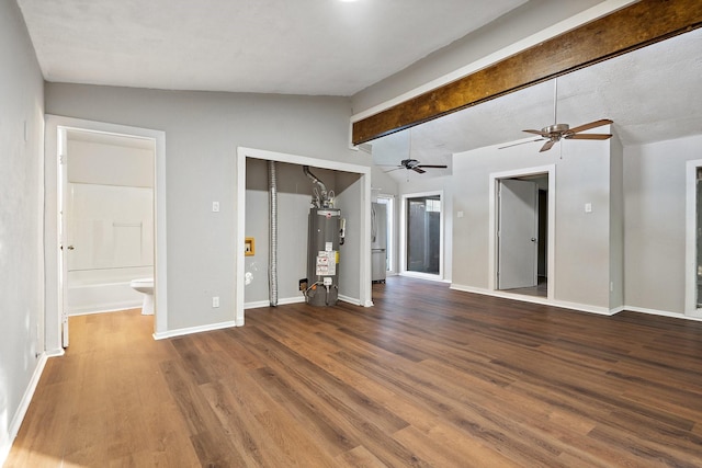 unfurnished living room featuring water heater, wood-type flooring, and lofted ceiling