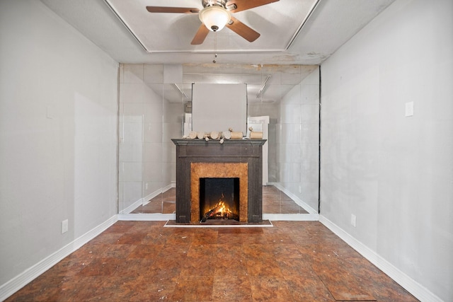 unfurnished living room featuring ceiling fan